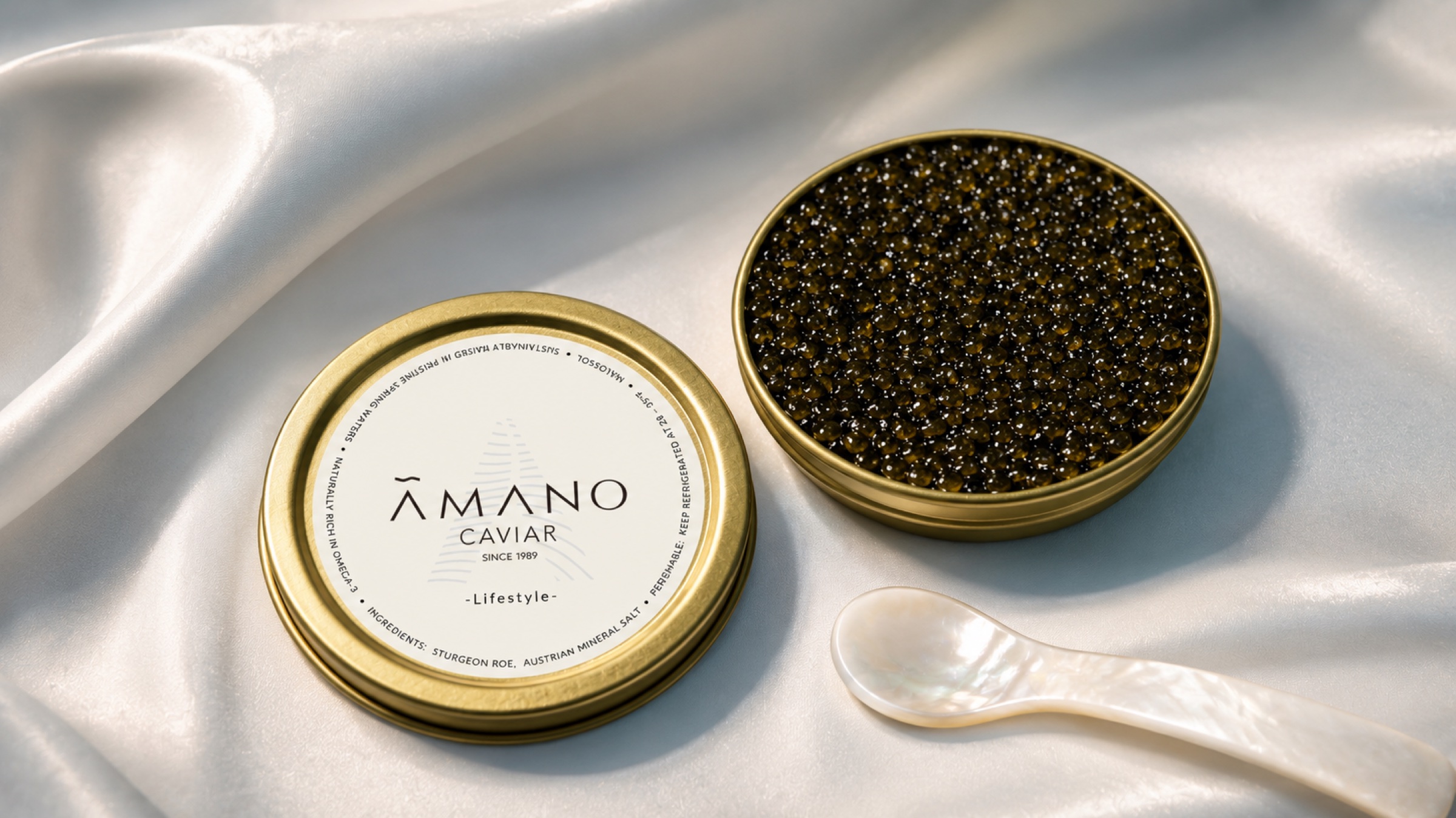AMANO Lifestyle caviar on luminous ivory silk with a mother-of-pearl spoon