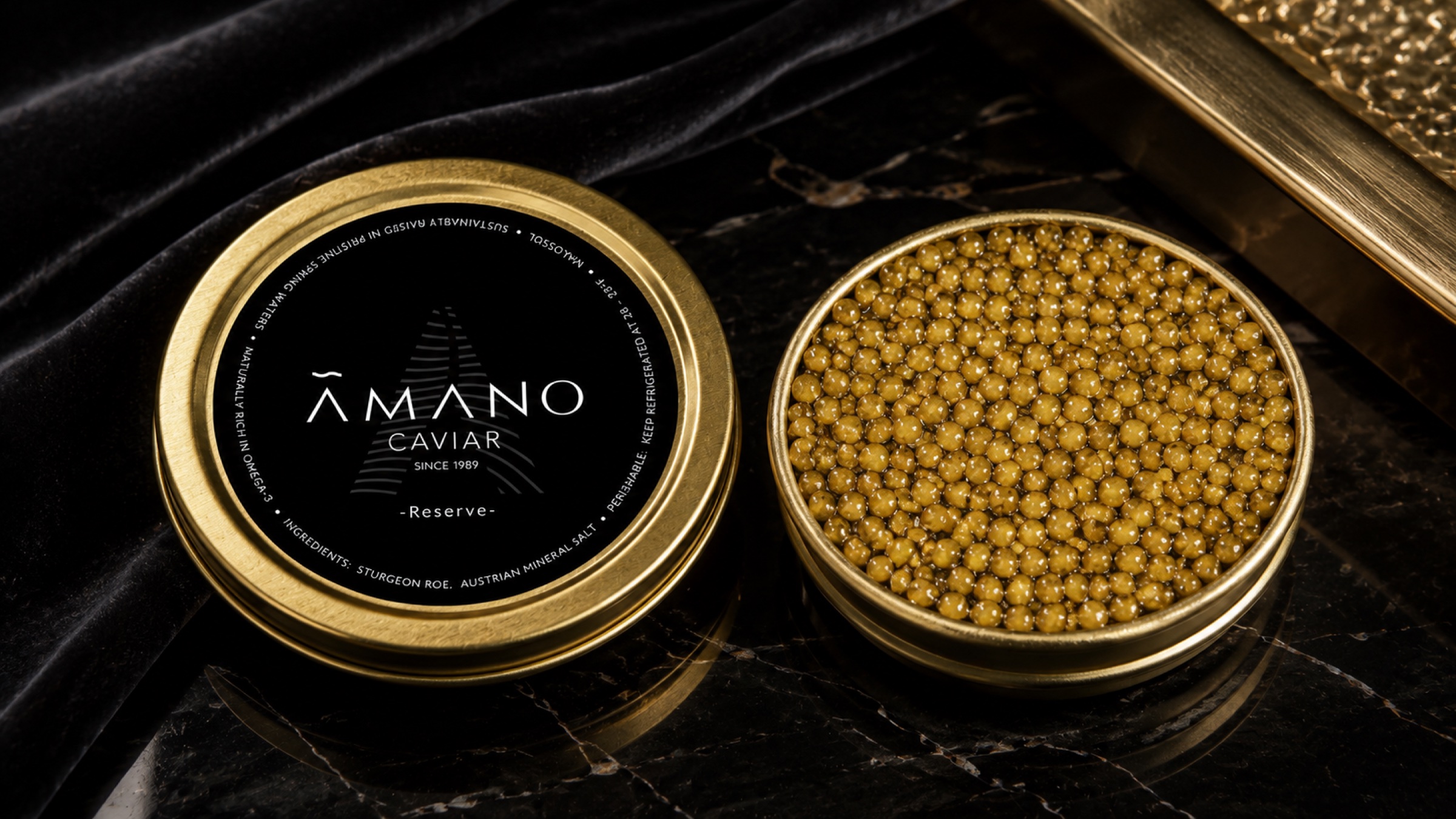 AMANO Reserve caviar on black stone with restrained gold light