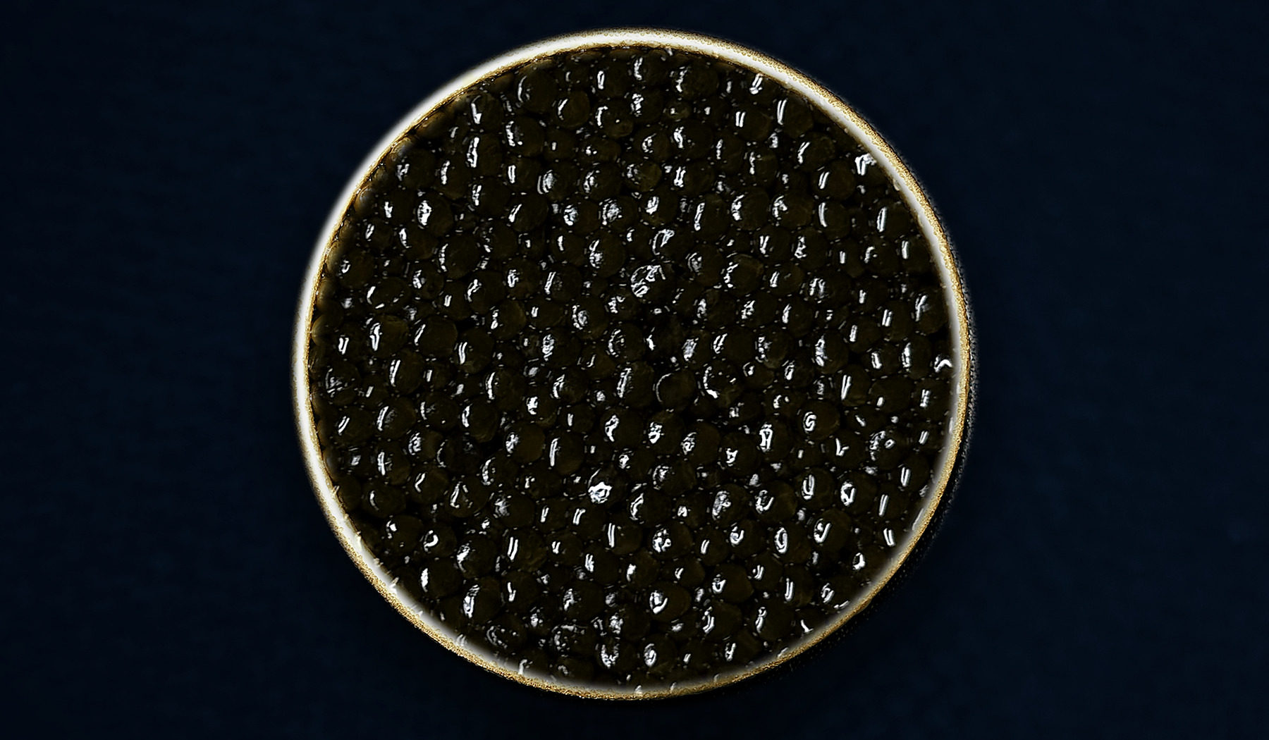 Closer view of an open tin of AMANO Ossetra caviar; natural batches vary