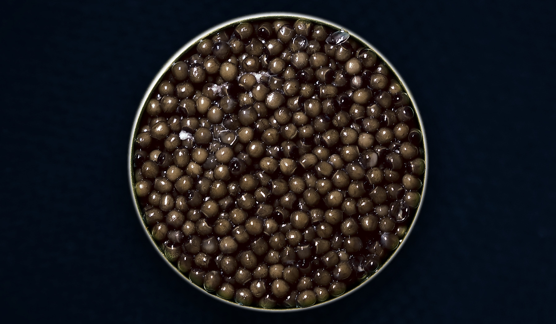 Closer view of an open tin of AMANO Schrenckii caviar; natural batches vary