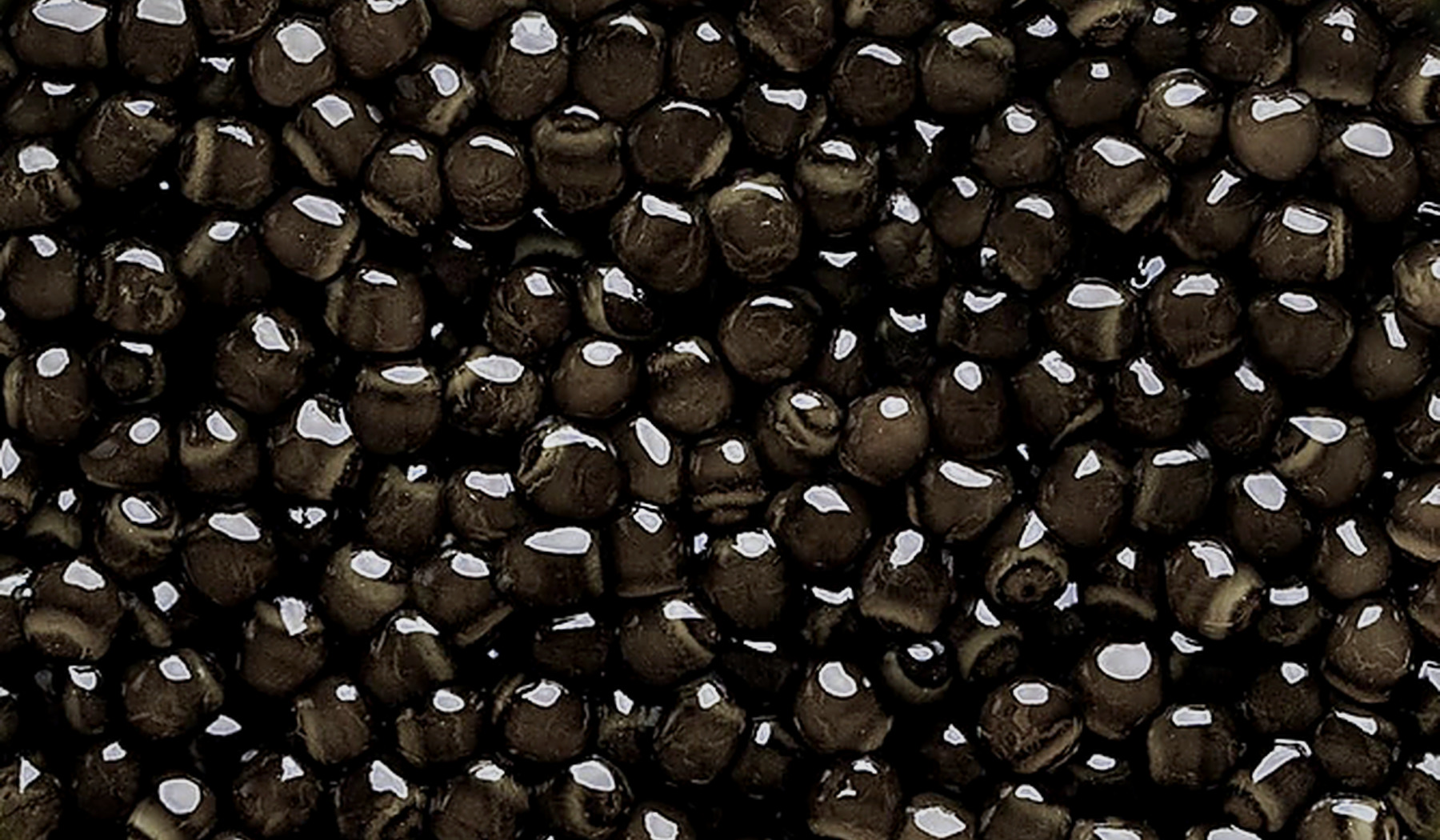Macro view of AMANO Siberian caviar pearls from the same editorial batch